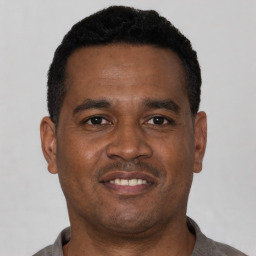Neutral black young-adult male with short  black hair and brown eyes
