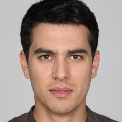 Neutral white young-adult male with short  brown hair and brown eyes