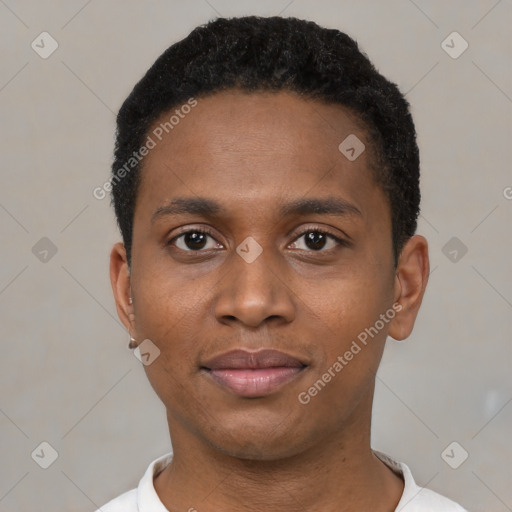 Joyful black young-adult male with short  black hair and brown eyes