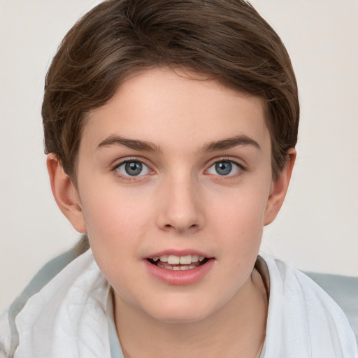 Joyful white child female with short  brown hair and grey eyes