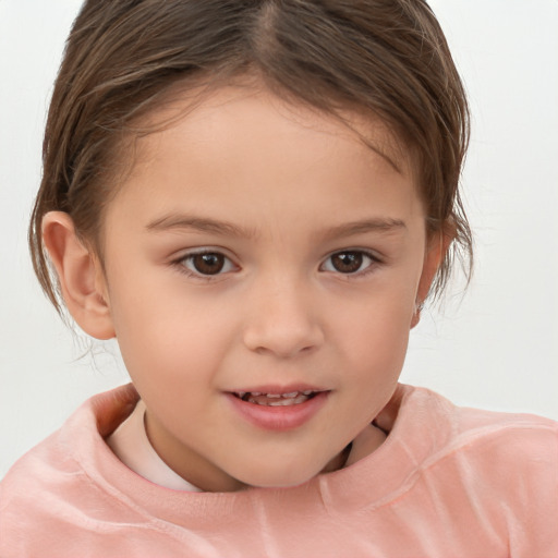 Joyful white child female with short  brown hair and brown eyes