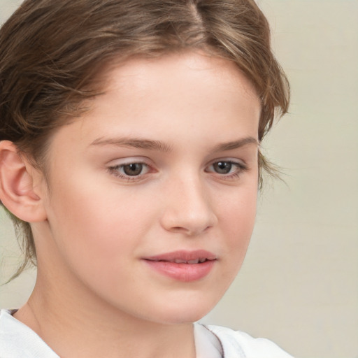 Joyful white child female with short  brown hair and brown eyes