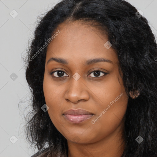 Joyful black young-adult female with long  black hair and brown eyes