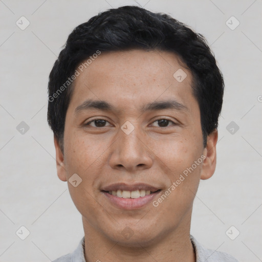 Joyful asian young-adult male with short  black hair and brown eyes