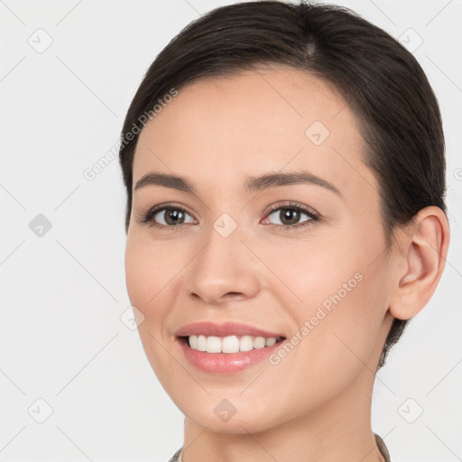 Joyful white young-adult female with medium  brown hair and brown eyes