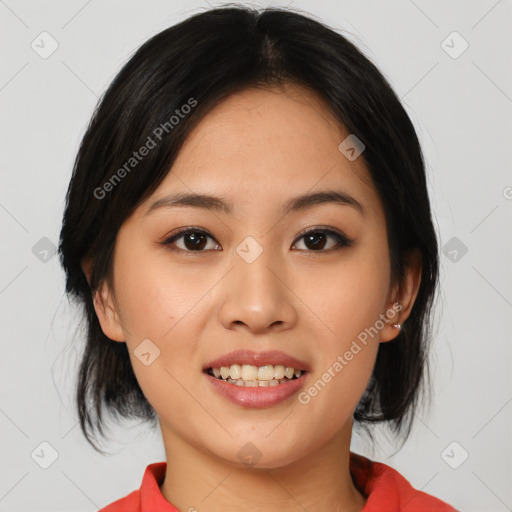 Joyful asian young-adult female with medium  black hair and brown eyes