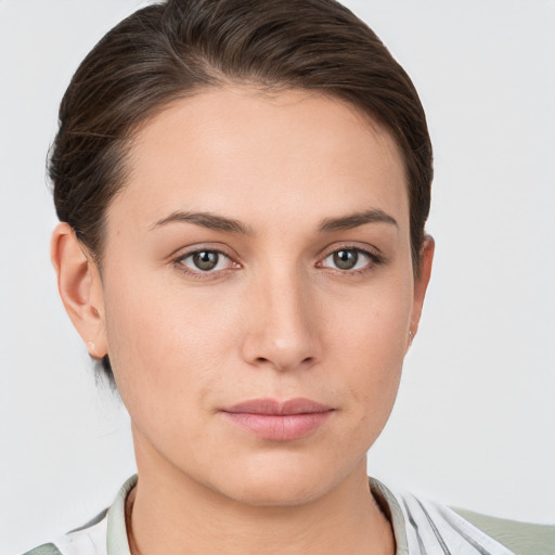 Neutral white young-adult female with short  brown hair and grey eyes