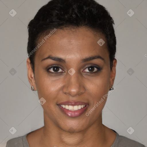 Joyful black young-adult female with short  black hair and brown eyes