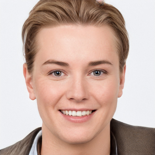 Joyful white young-adult female with short  brown hair and grey eyes