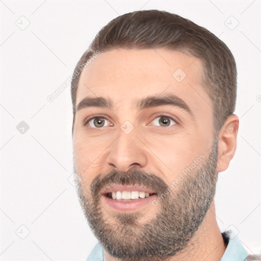 Joyful white young-adult male with short  black hair and brown eyes