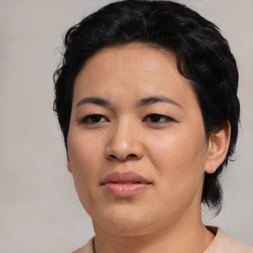 Joyful asian young-adult female with short  black hair and brown eyes