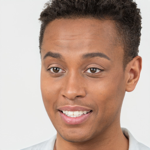 Joyful black young-adult male with short  brown hair and brown eyes