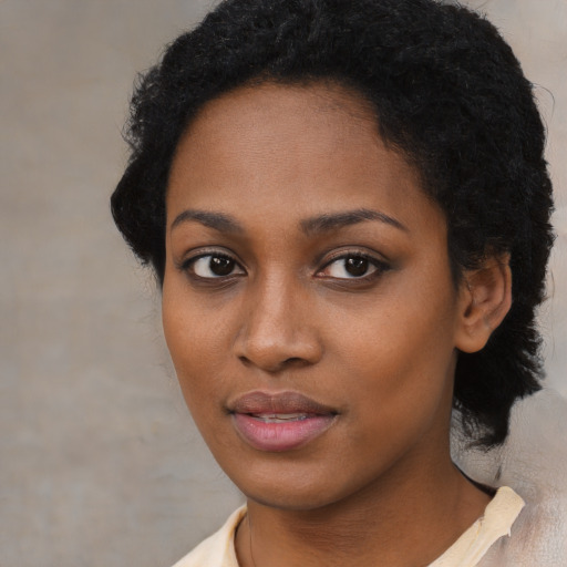 Neutral black young-adult female with medium  black hair and brown eyes