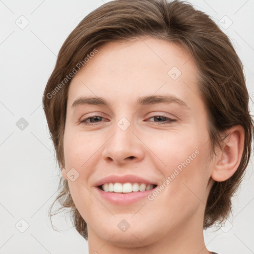 Joyful white young-adult female with medium  brown hair and green eyes