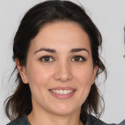 Joyful white young-adult female with medium  brown hair and brown eyes