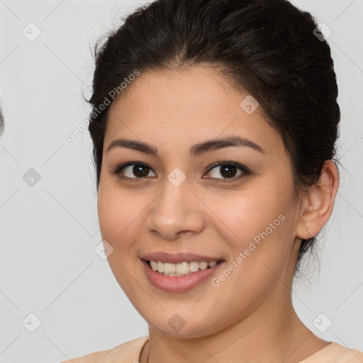 Joyful latino young-adult female with medium  brown hair and brown eyes