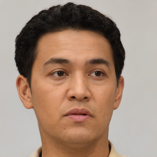 Neutral latino young-adult male with short  brown hair and brown eyes