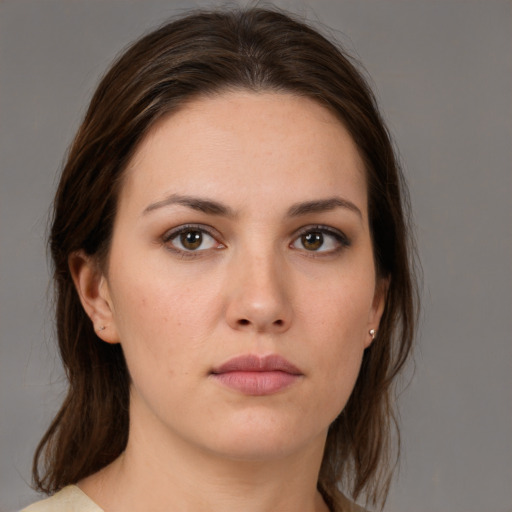 Neutral white young-adult female with medium  brown hair and brown eyes