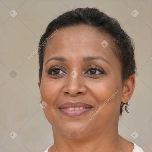 Joyful black adult female with short  brown hair and brown eyes