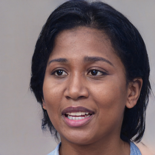 Joyful latino young-adult female with medium  black hair and brown eyes