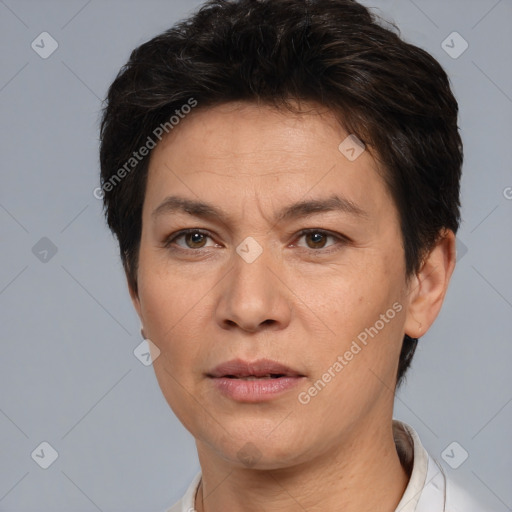 Joyful white adult female with short  brown hair and brown eyes