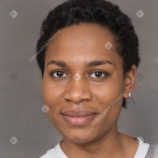 Joyful black young-adult female with short  black hair and brown eyes