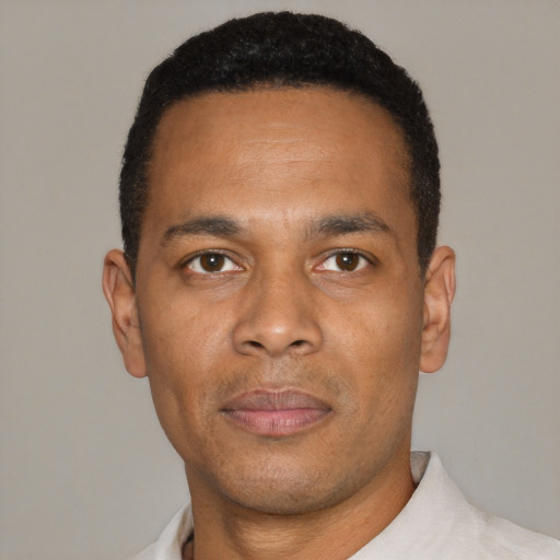 Neutral black adult male with short  black hair and brown eyes