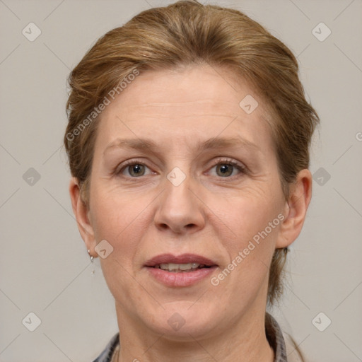 Joyful white adult female with short  brown hair and grey eyes