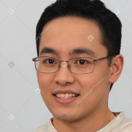 Joyful white young-adult male with short  black hair and brown eyes