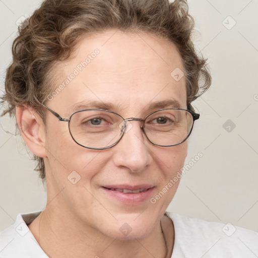 Joyful white adult female with short  brown hair and blue eyes