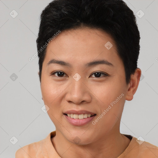 Joyful asian young-adult female with short  black hair and brown eyes