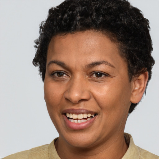 Joyful latino young-adult female with short  brown hair and brown eyes