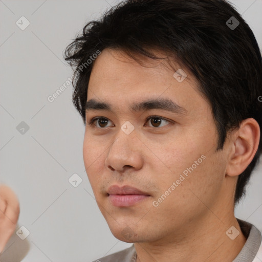 Neutral white young-adult male with short  black hair and brown eyes