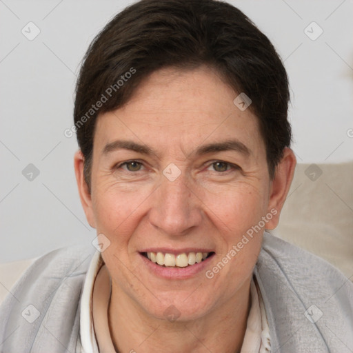 Joyful white adult female with short  brown hair and brown eyes