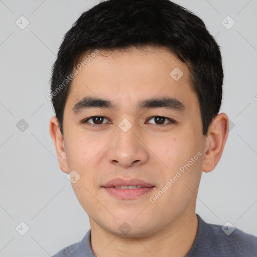 Joyful white young-adult male with short  black hair and brown eyes