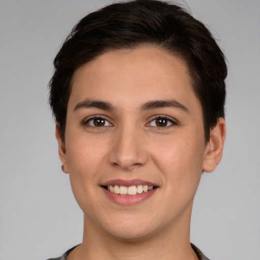 Joyful white young-adult female with short  brown hair and brown eyes