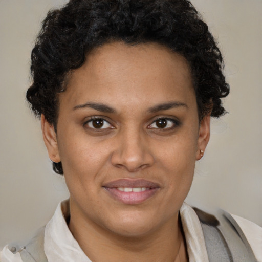 Joyful latino young-adult female with short  brown hair and brown eyes