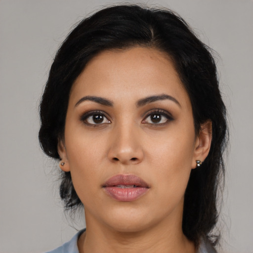 Neutral latino young-adult female with long  black hair and brown eyes