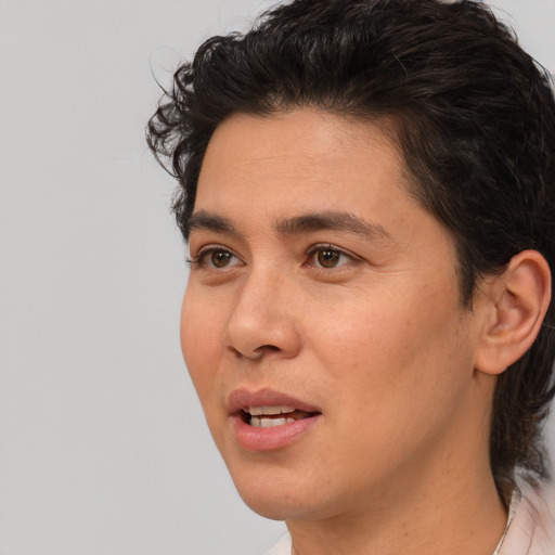 Joyful white young-adult male with medium  brown hair and brown eyes