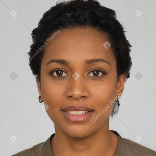 Joyful black young-adult female with short  black hair and brown eyes