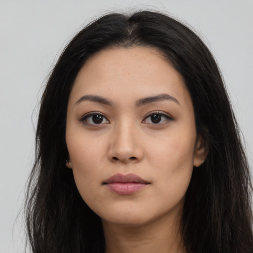 Neutral latino young-adult female with long  black hair and brown eyes