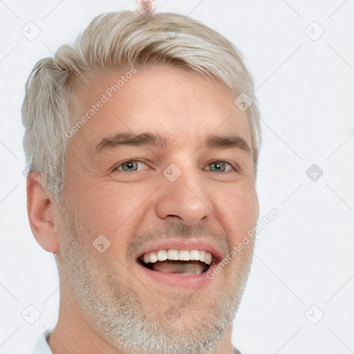 Joyful white adult male with short  brown hair and blue eyes