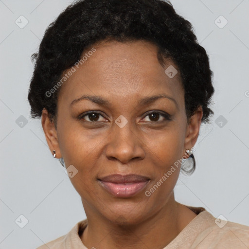 Joyful black adult female with short  brown hair and brown eyes