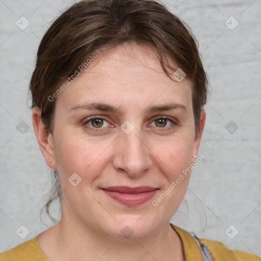 Joyful white adult female with medium  brown hair and grey eyes