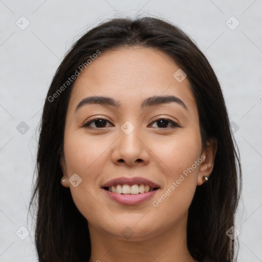 Joyful asian young-adult female with long  brown hair and brown eyes