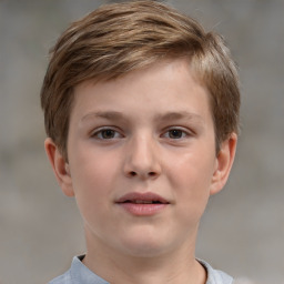 Joyful white child male with short  brown hair and brown eyes