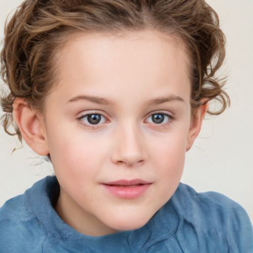 Joyful white child female with medium  brown hair and blue eyes