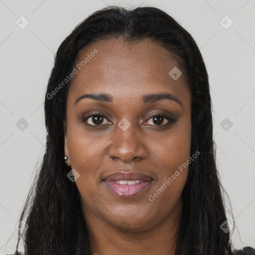 Joyful black young-adult female with long  brown hair and brown eyes