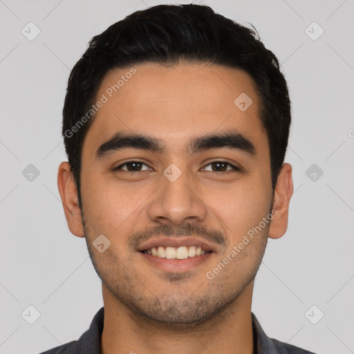 Joyful latino young-adult male with short  black hair and brown eyes