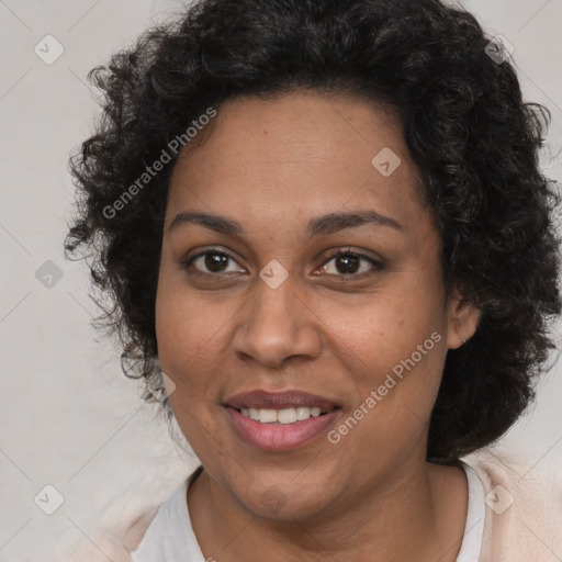 Joyful black adult female with medium  brown hair and brown eyes